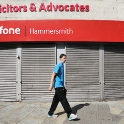 Full length of young man standing in city