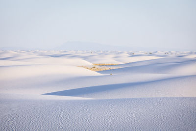 Scenic view of desert against sky during winter