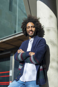 Portrait of smiling young man standing outdoors