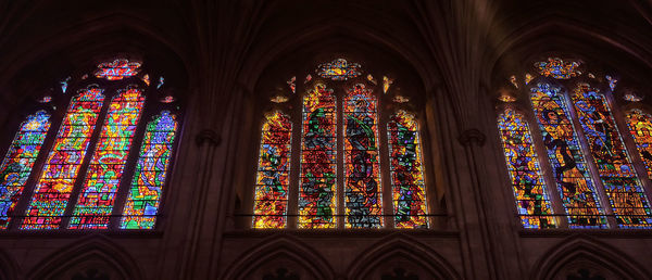 Low angle view of stained glass window of building