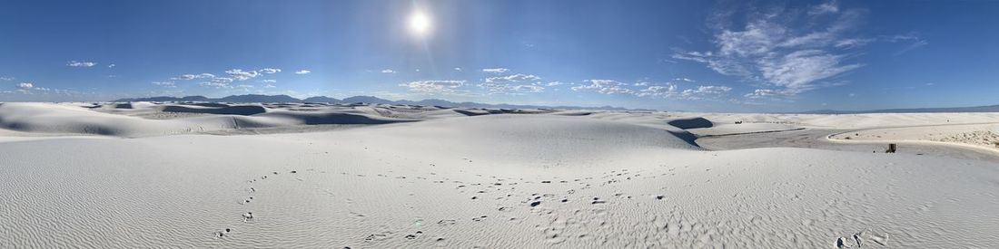 Panoramic view of snowcapped landscape against sky