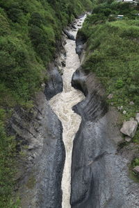 High angle view of water flowing through rocks