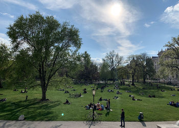 People on landscape against sky