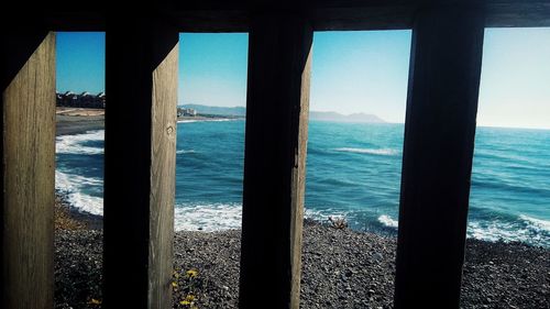 Scenic view of sea seen through window