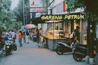 People walking on street in city