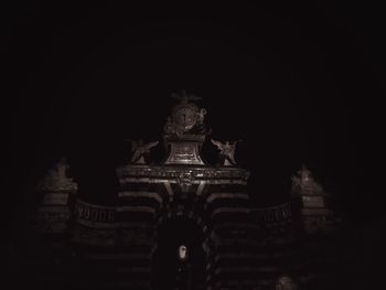 Low angle view of historical building at night