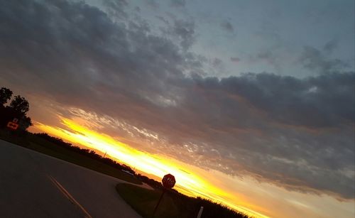 Scenic view of cloudy sky at sunset