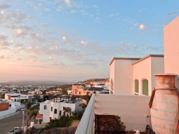 High angle view of buildings against sky during sunset