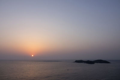 Scenic view of sea against clear sky during sunset