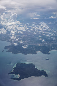 Aerial view of island and sea against sky