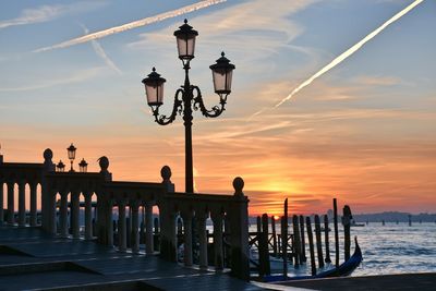 Street light against sky during sunset