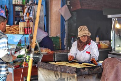 Man working at market stall