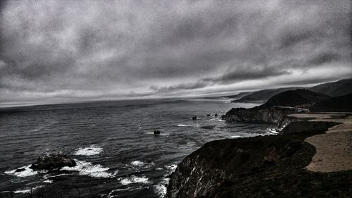 Scenic view of sea against cloudy sky