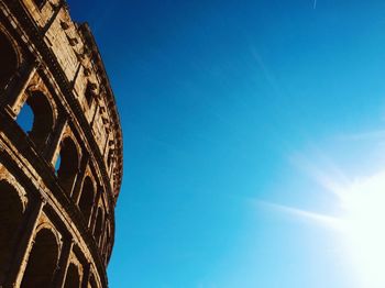 Low angle view of historical building against blue sky