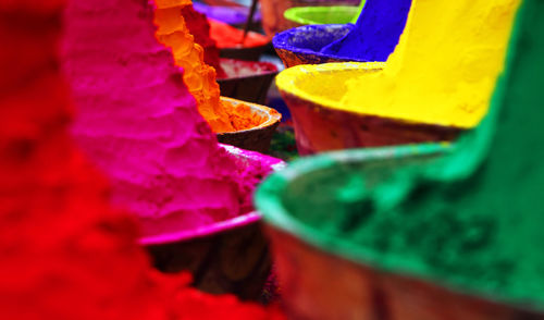 High angle view of colorful powder paints for sale at market stall