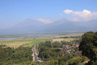 Scenic view of landscape and mountains against sky