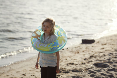 Smiling girl with inflatable ring