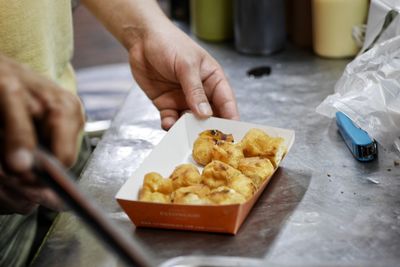 Close-up of person preparing food