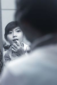 Portrait of a young woman looking away