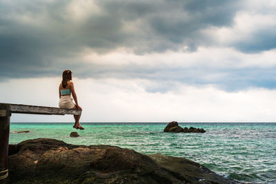 Man looking at sea against sky