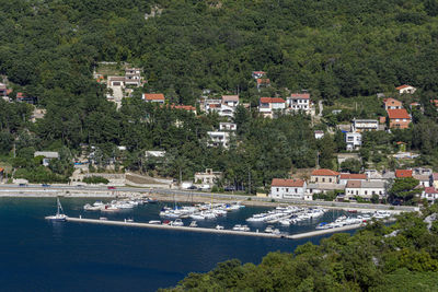 High angle view of townscape by sea