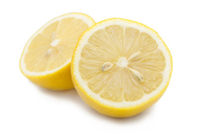 Close-up of lemon slice against white background