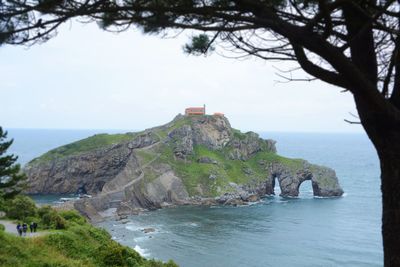 Scenic view of sea and rocks against sky