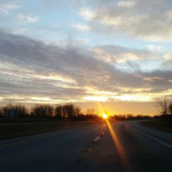 Empty road at sunset