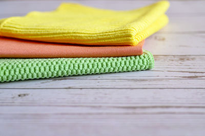 Close-up of yellow shoes on table