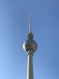 Low angle view of communications tower against clear sky