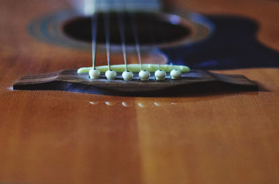 Close-up of guitar on table