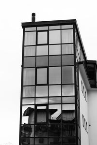 Low angle view of modern building against clear sky