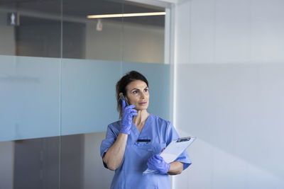 Female nurse talking on phone