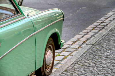 Close-up of vintage car on street