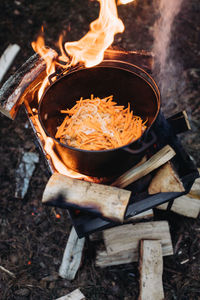 High angle view of bonfire on barbecue grill