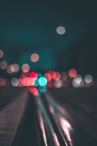 Defocused image of illuminated lights at night