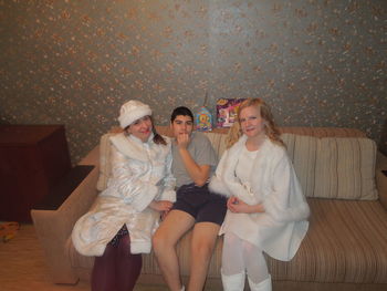 Young couple sitting at home