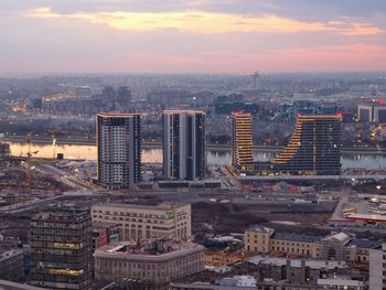 High angle view of city buildings during sunset