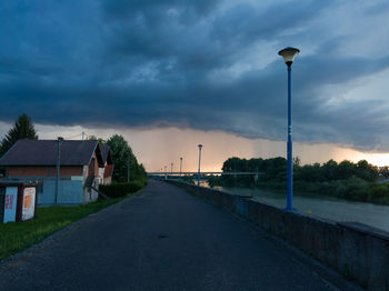 Street amidst buildings against sky