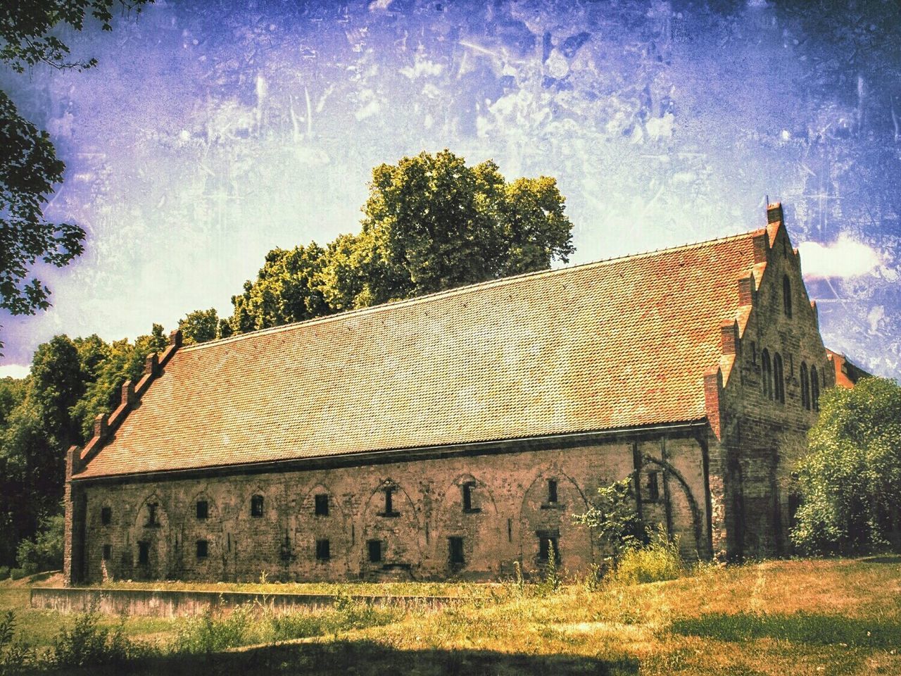 architecture, built structure, building exterior, tree, sky, house, grass, field, growth, nature, day, outdoors, roof, no people, cloud - sky, plant, low angle view, auto post production filter, old, landscape