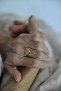 Cropped hands of senior woman wearing ring