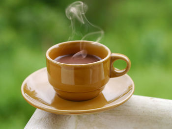 Close-up of coffee cup on table