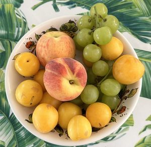 High angle view of fruits in plate on table