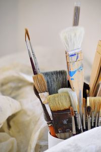 Close-up of paintbrushes in kitchen