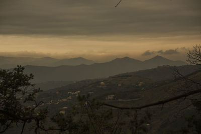 Scenic view of mountains against sky during sunset