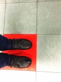 Low section of man standing on floor