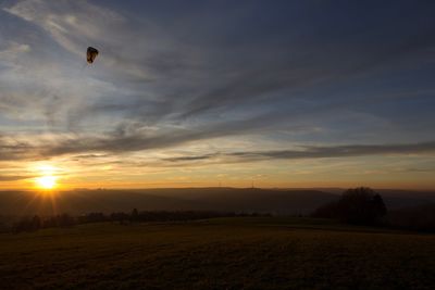 Scenic view of sunset over land