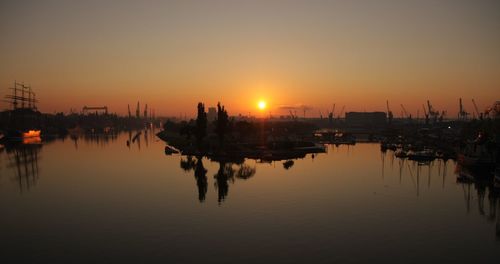 Scenic view of river against sky during sunset