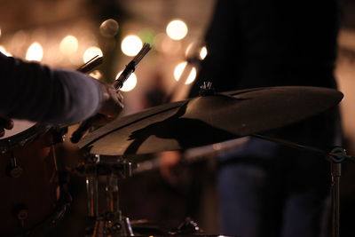 Close-up of man playing drums