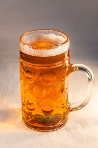 Close-up of beer glass on table